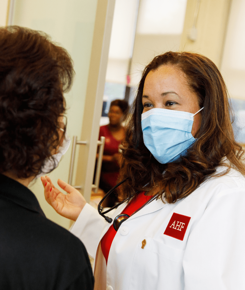 A Doctor at AHF consulting a patient